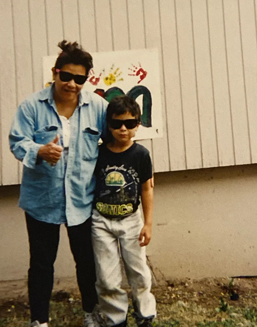 With my mom, both of us in sunglasses